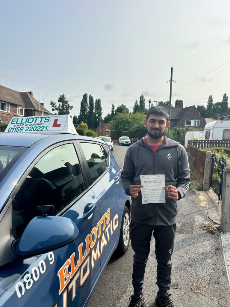 Dom passing their driving test with Elliotts School of Motoring